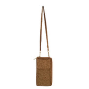 A compact adjustable strap crossbody and wallet in one, designed for hands-free convenience with timeless natural cork texture. 