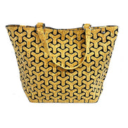 Cork geometric patterned handbag on a white background