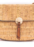 Natural cork crossbody bag front view with gold button detail and adjustable strap