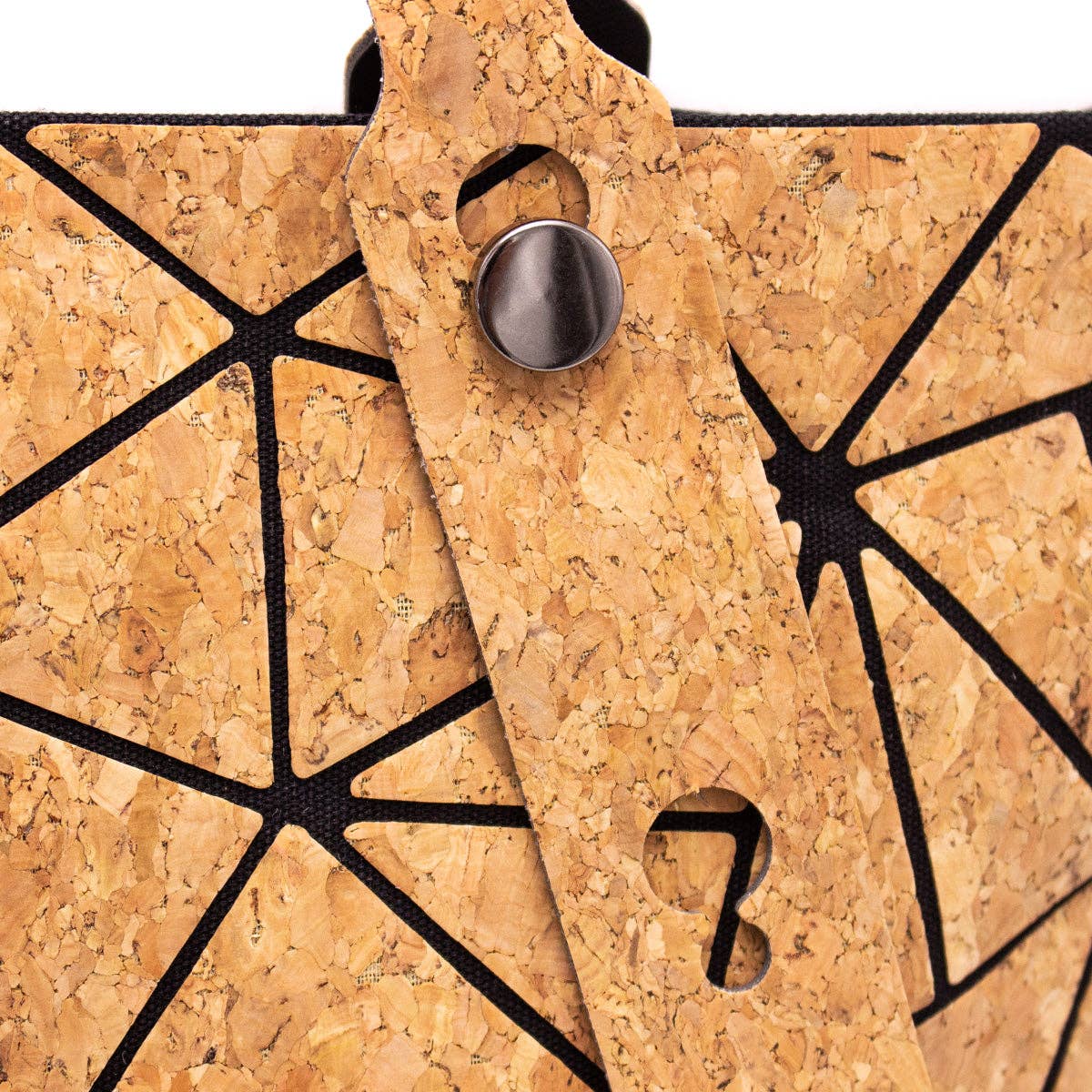 Close up view of adjustable handle cork geometric print cork tote bag
