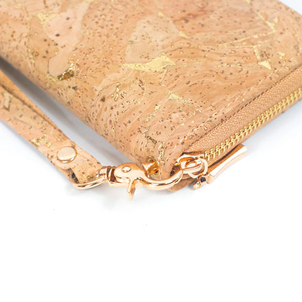 Close-up of gold zipper and wristlet hardware on cork wallet