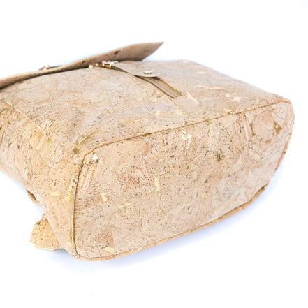 Bottom base of gold-fleck cork backpack