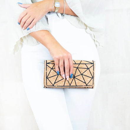 Cork geometric crossbody wallet with chain strap over shoulder