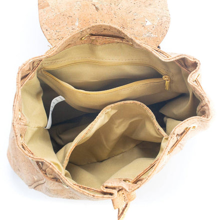 nterior view of the golden cork backpack showing divider and pockets