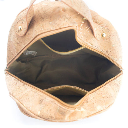 Interior view of molten gold cork backpack showing pockets and lining