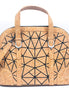 Front view of geometric cork handbag with black line pattern