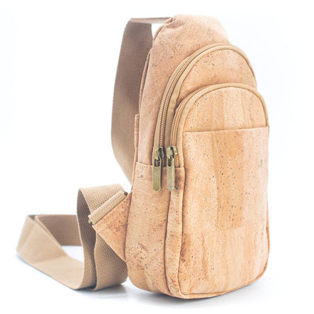 Close-up front pocket and zippers on natural cork sling bag
