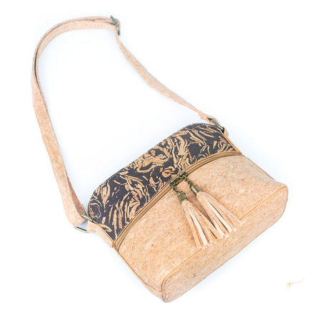 Top view of cork crossbody bag with adjustable straps and tassels