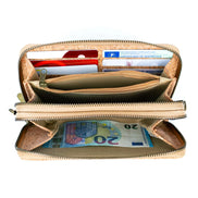 Open beige wallet with cards and money on a white background