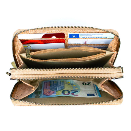 Open beige wallet with cards and money on a white background