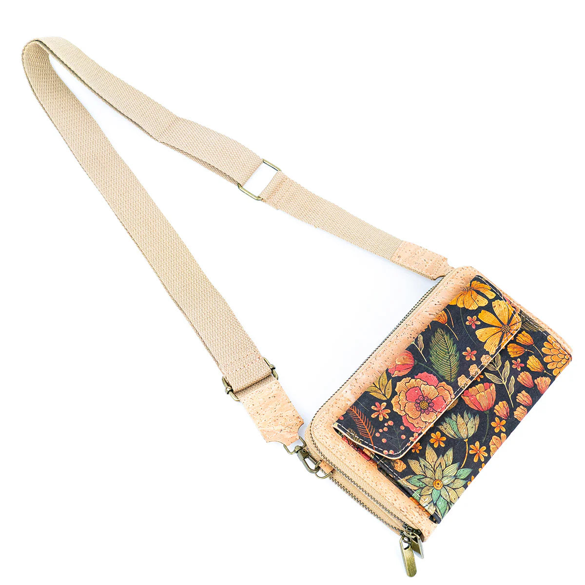 Floral patterned crossbody bag with beige strap on a white background