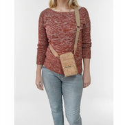 Keep your essentials organized in sustainable style with this compact, eco-friendly Cork Phone Bag and wallet. 