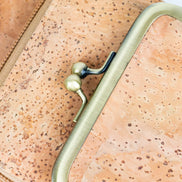 Keep your essentials organized in sustainable style with this compact, eco-friendly Cork Phone Bag and wallet. 