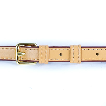 Adjustable faux leather shoulder strap on floral cork handbag