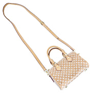 Floral Cork Crossbody Barrel Bag front view with daisy pattern and leather handles