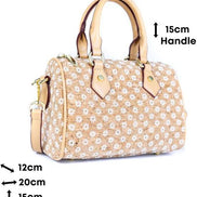 Floral Cork Crossbody Barrel Bag front view with daisy pattern and leather handles