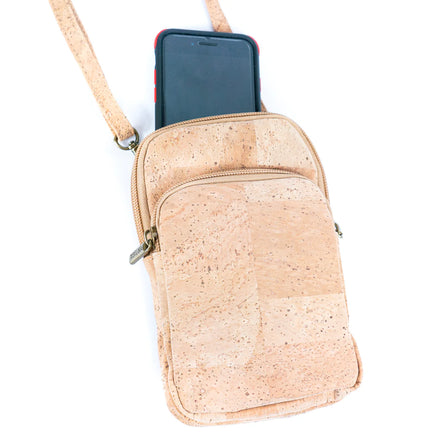A compact cork crossbody phone bag with three zippered compartments with a detachable and adjustable shoulder strap designed for grab-and-go days.