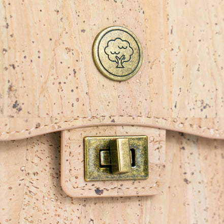 Antique brass twist lock close-up on cork phone bag