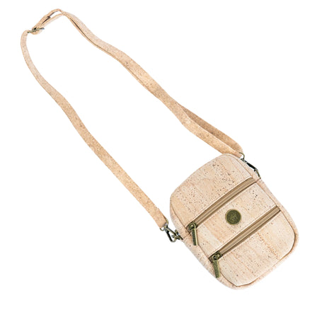 Flat lay of cork crossbody phone bag with long adjustable strap