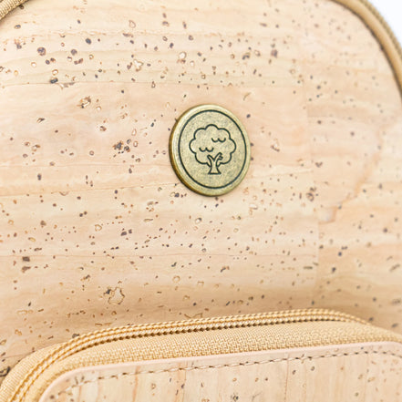 Cork tree emblem detail on eco-friendly crossbody