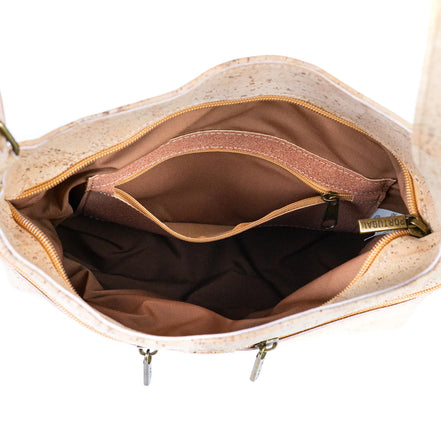 Spacious interior of cork crossbody bag with inner zip pocket