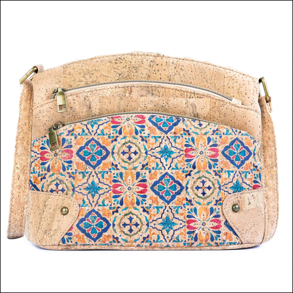 Front view of natural cork crossbody bag with colorful tile pattern and triple zipper design