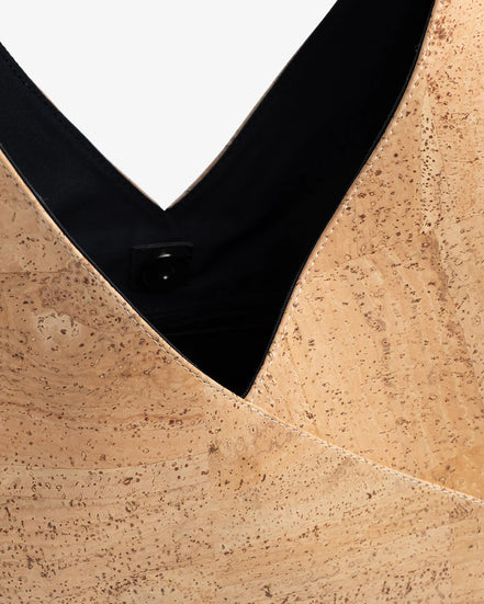 Interior view of cork tote showing large main compartment and pockets