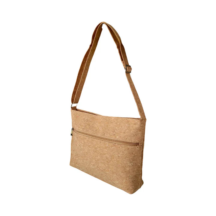 Lightweight cork handbag with long adjustable strap shown from side angle