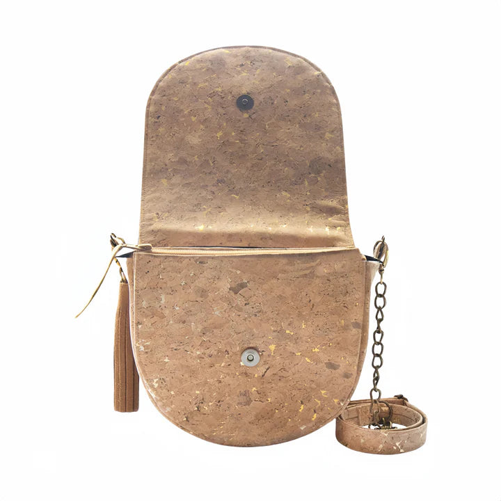 Gold flake cork handbag with flap open showing zipper closure and interior access