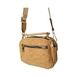 Lightweight cork crossbody bag shown with full adjustable strap for hands-free wear