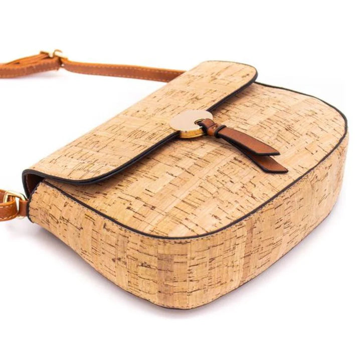 Angled view of cork crossbody showcasing structured shape and natural grains
