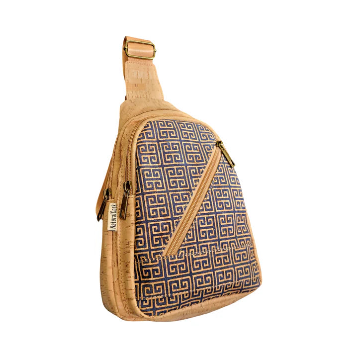 Side angled view of vegan cork sling bag showing printed front and adjustable strap.