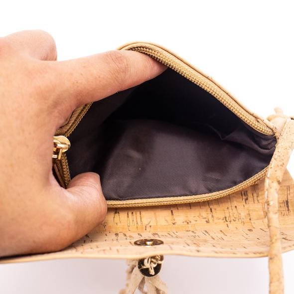 Inside compartment of cork crossbody bag with zipper pocket