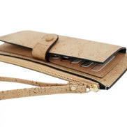 A luxurious soft cork wallet with a wristlet strap, perfect to keep your cards and cash neatly organized.