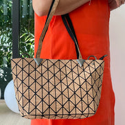 Stylish geometric design tote or shoulder bag with natural cork texture and large interior compartment for wallet, tablet, notebooks & more.