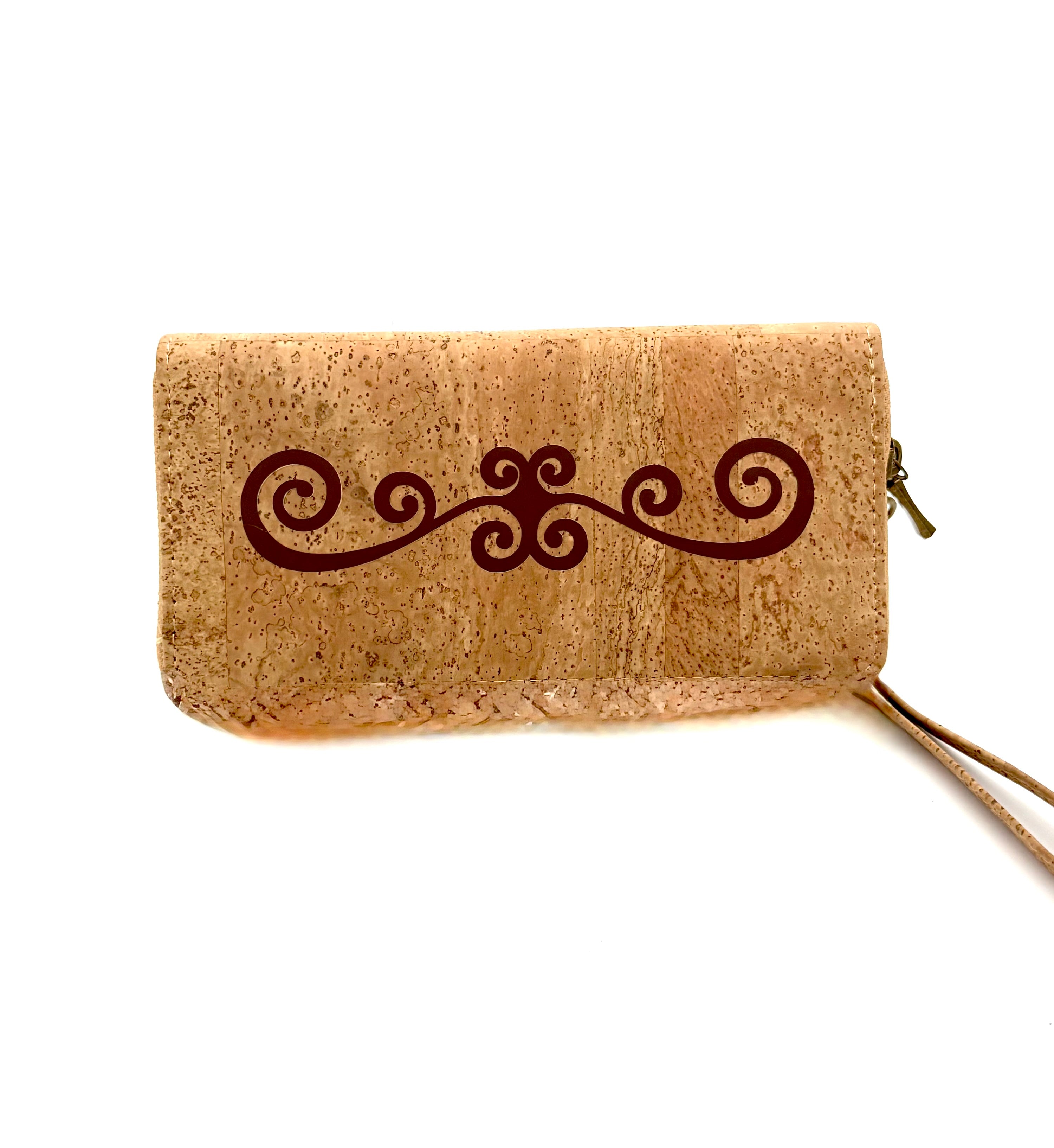 Cork wallet with decorative swirl design on a white background
