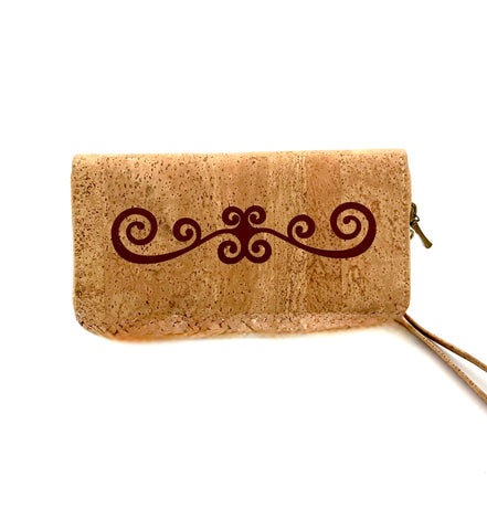 Cork wallet with decorative swirl design on a white background