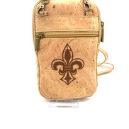 Cork crossbody bag with a fleur-de-lis design on a white background