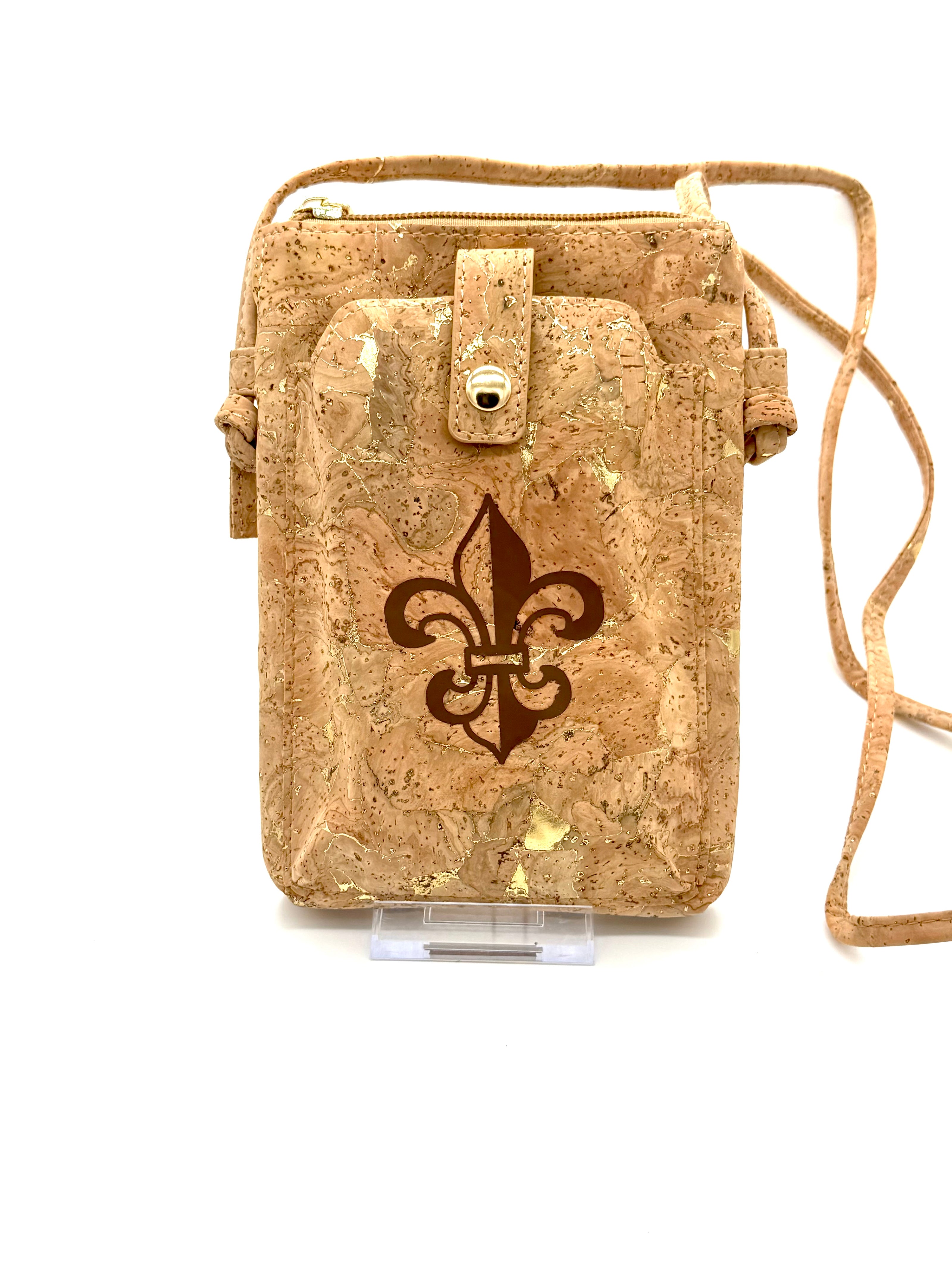 Cork crossbody bag with a fleur-de-lis design on a white background
