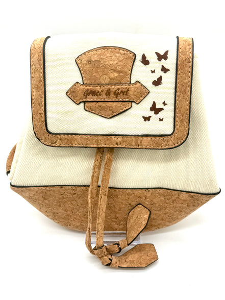 Backpack with cork accents and decorative elements on a white background