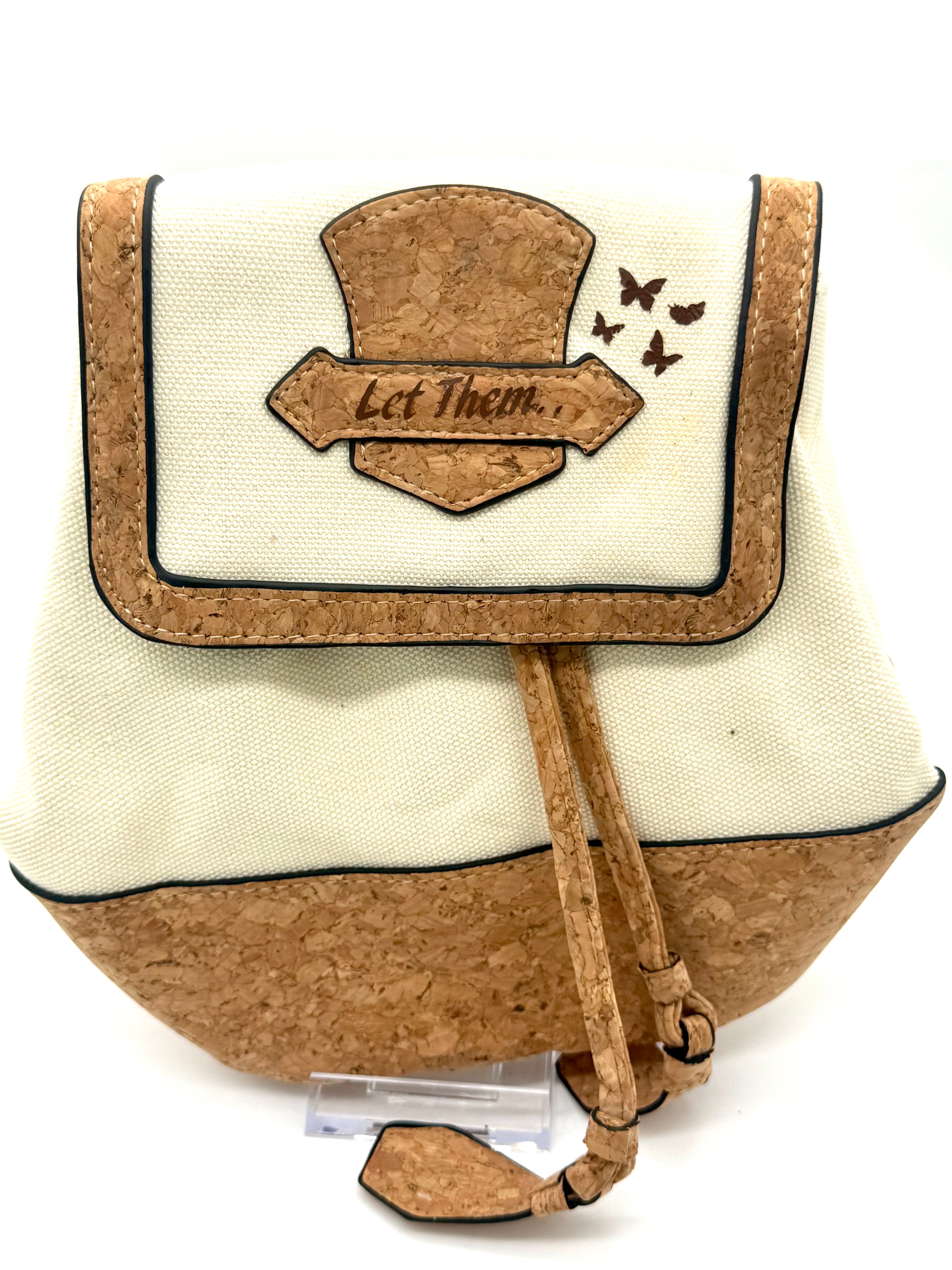 Small bag with cork top and bottom, white front panel, and 'Let Them' text on a white background