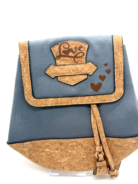Small blue and cork bag with a decorative flap on a white background