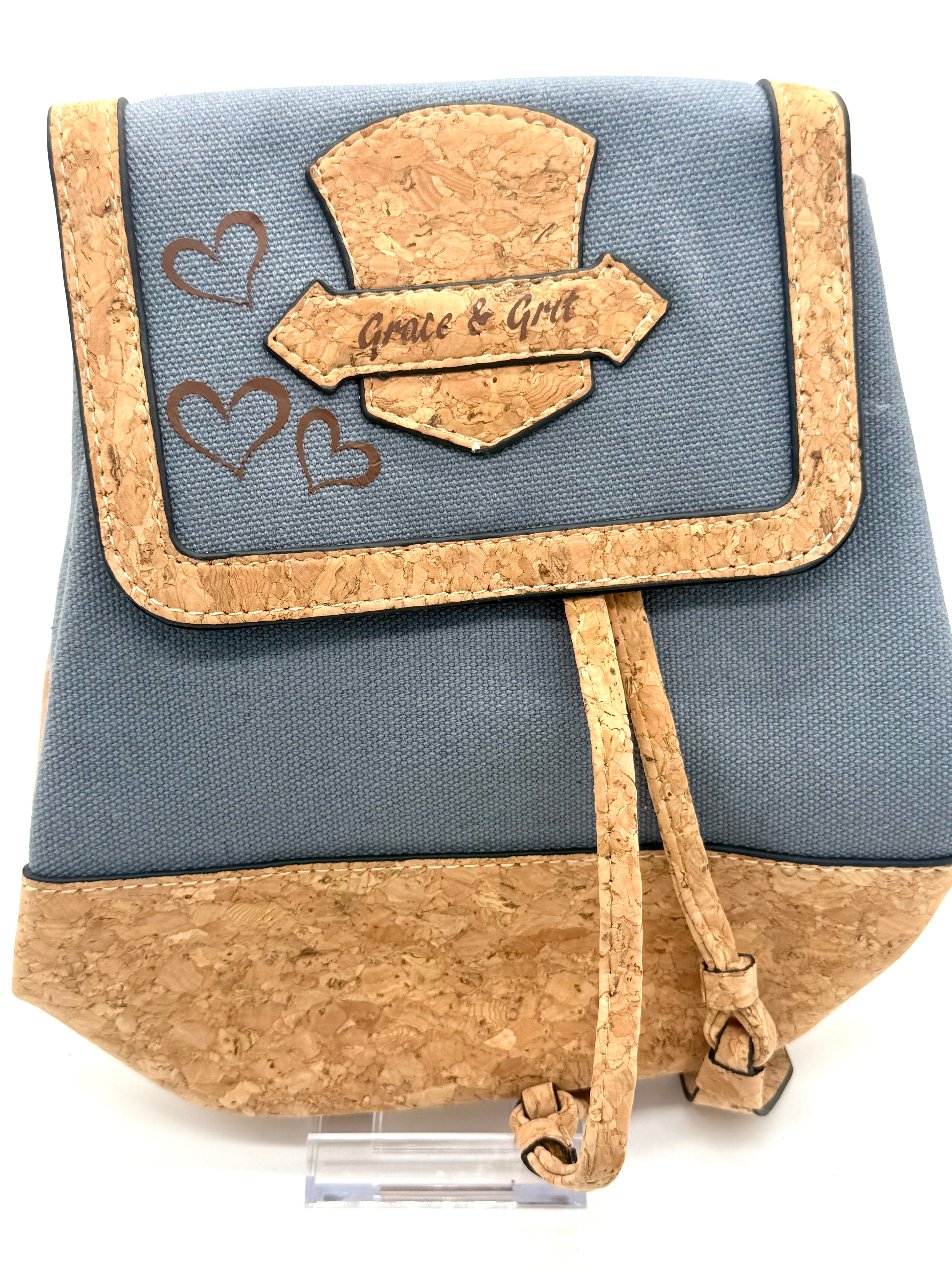 Small blue bag with cork accents and 'Grace & Gold' branding on a white background