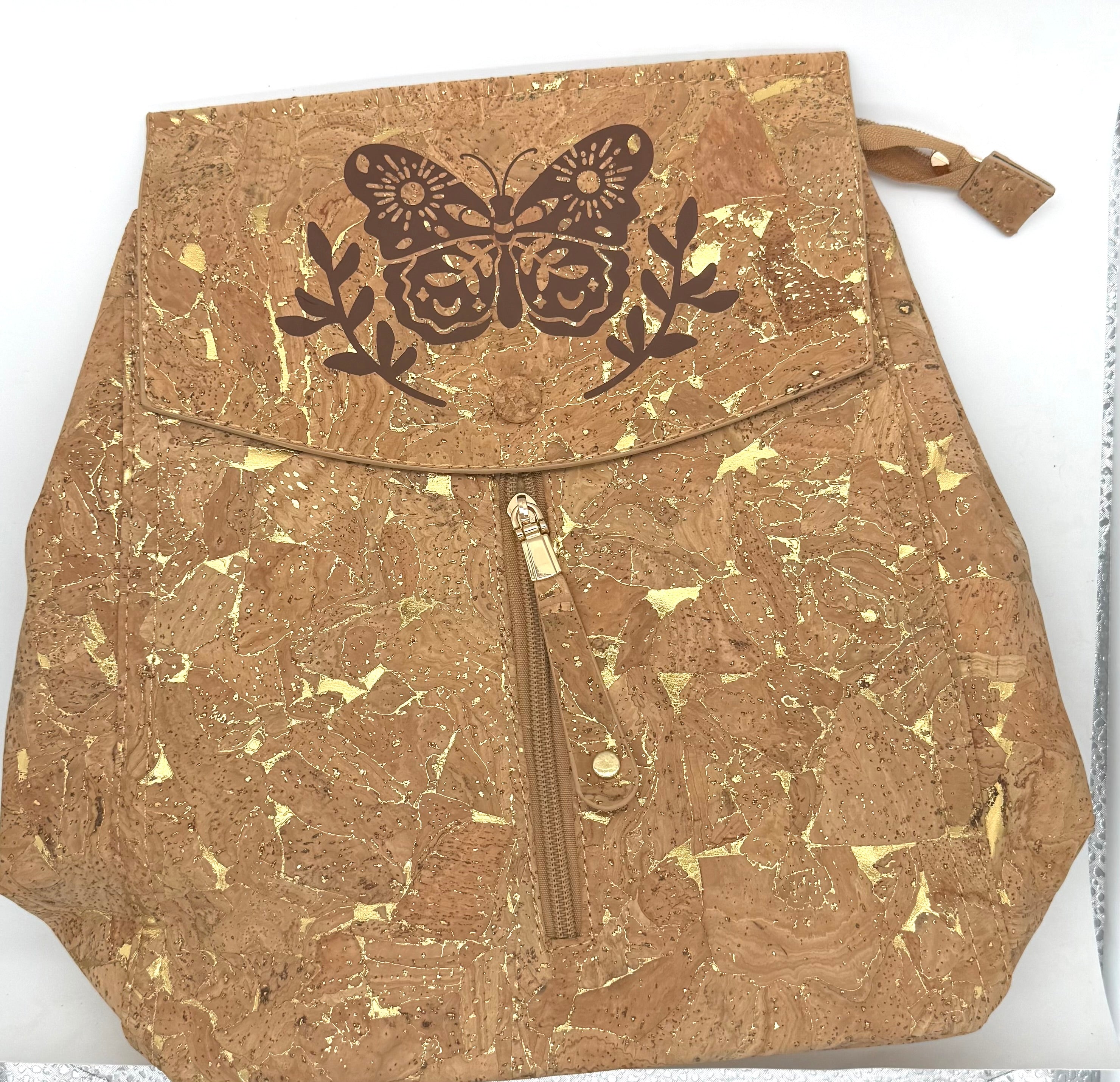 Cork backpack with butterfly design on a white background