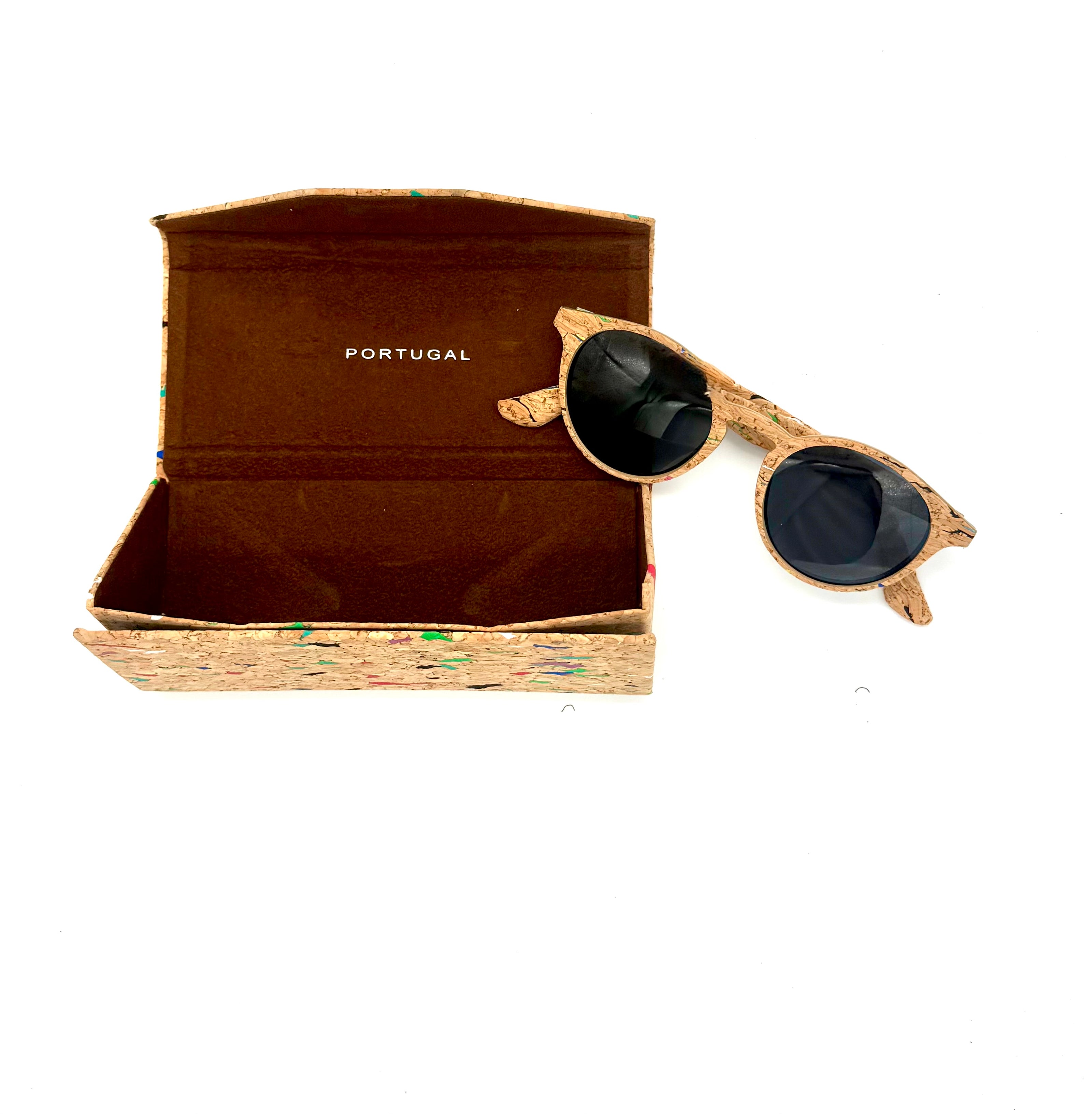 Cork sunglasses resting beside matching multicolor cork case