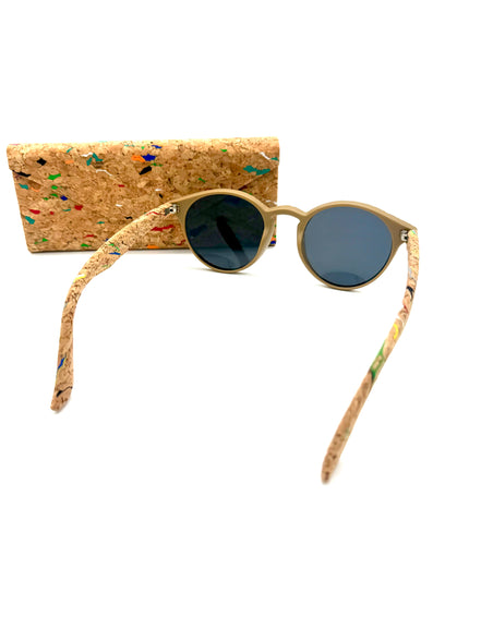 Cork sunglasses resting beside matching multicolor cork case