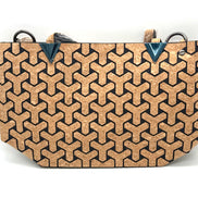 Cork handbag with geometric pattern on a white background