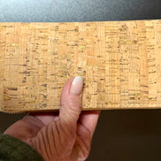 Lightweight vegan cork zipper wallet with detachable wristlet strap and organized interior.