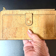 A luxurious soft cork wallet with a wristlet strap, perfect to keep your cards and cash neatly organized.