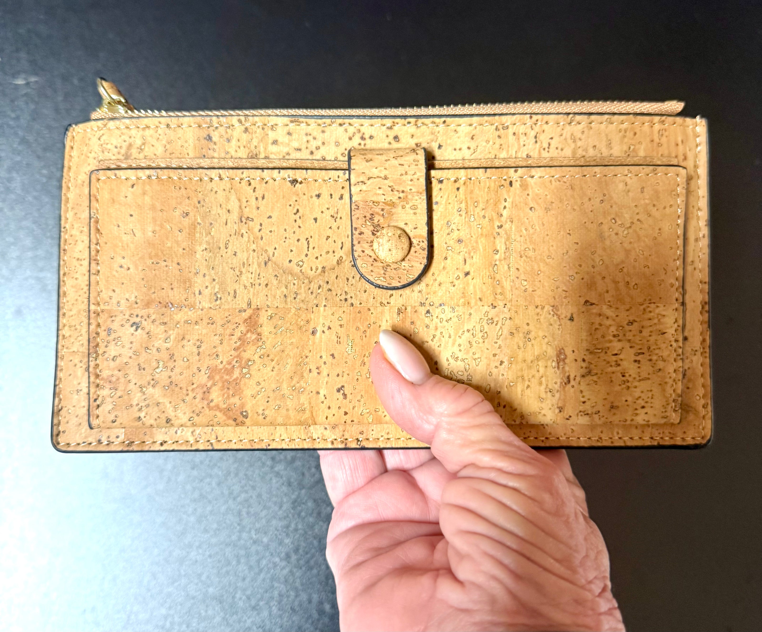 A luxurious soft cork wallet with a wristlet strap, perfect to keep your cards and cash neatly organized.